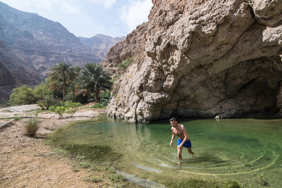 Planning a trip to Oman? You HAVE to visit Wadi Shab! Click to read how to get to Wadi Shab, what to expect when you arrive, plus why you should plan a trip there (and to Oman). | Oman Travel | Muscat to Wadi Shab | Sur to Wadi Shab | Oman Road trip | Wadi Shab Guide